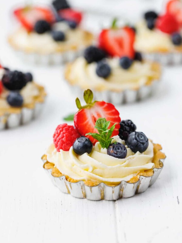 Low-Carb, Keto Tarts With Berries And Mascarpone Cream in a tart tin