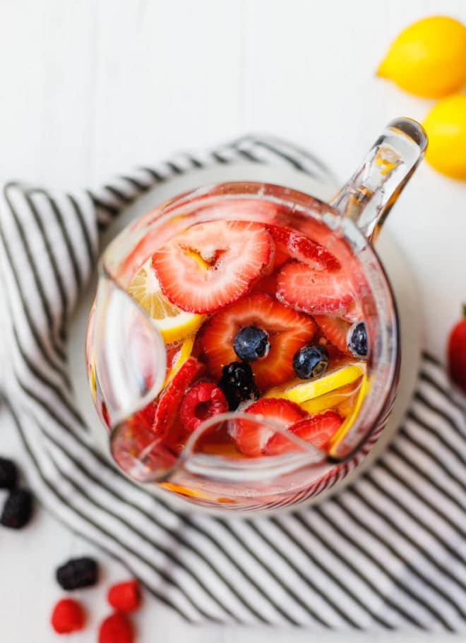 White Wine Berry Sangria Recipe in a pitcher filled with berries