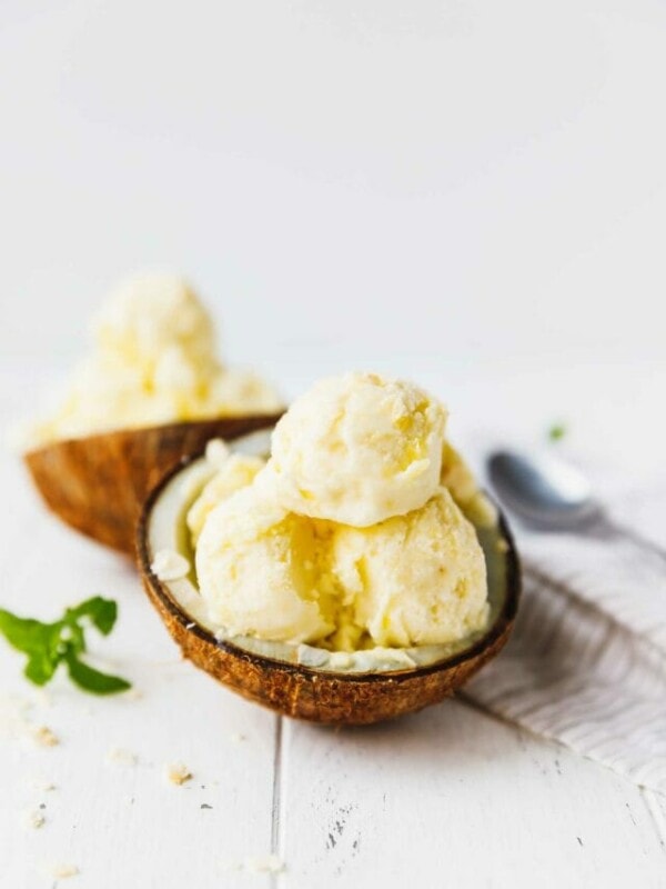 two ingredient pineapple coconut ice cream in a coconut bowl
