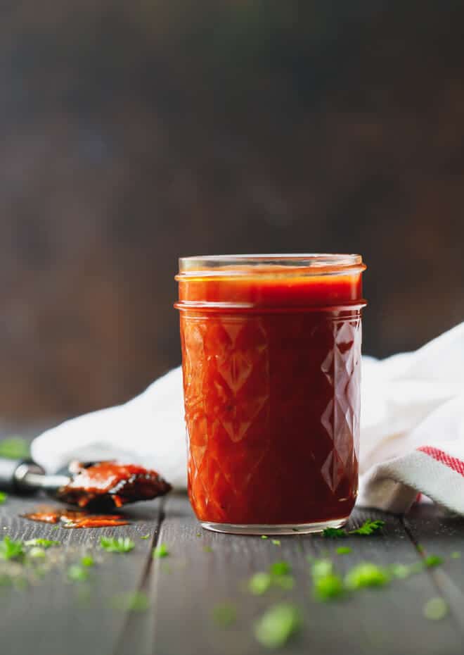 Keto Bbq sauce in a jar with a brush
