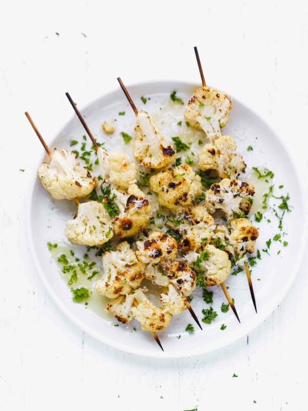 Grilled Cauliflower florets on a skewer on a plate
