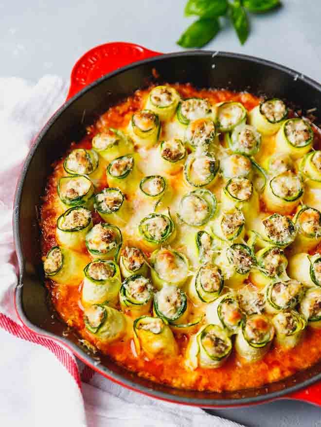 Zucchini Lasagna Roll Ups in a cast iron pan