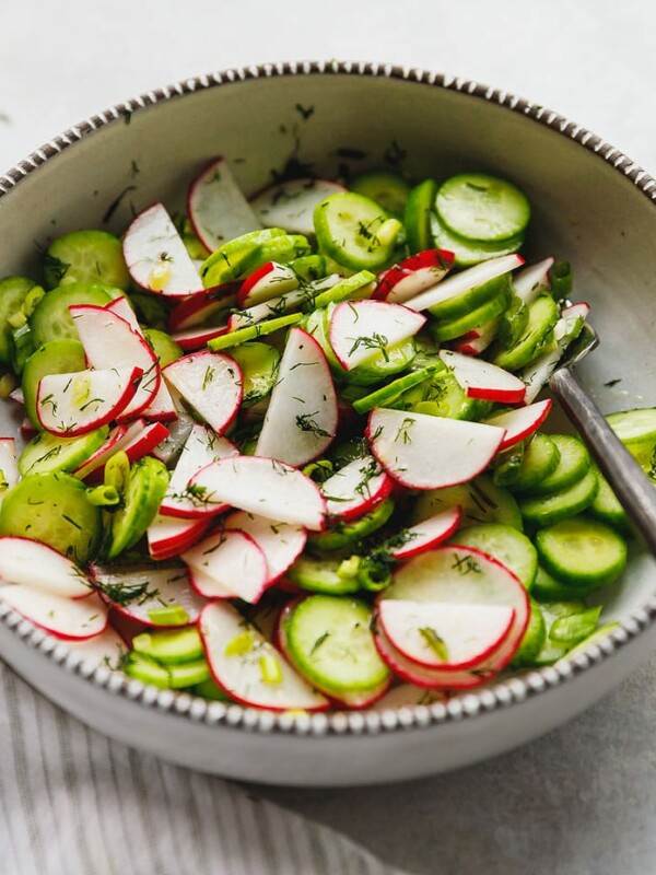 Cucumber radish salad with dill in a bowl