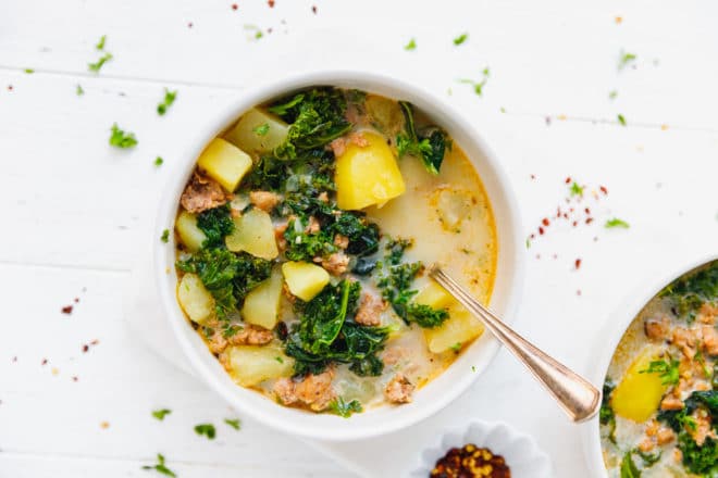 Kale Sausage Potato Soup in a bowl with a spoon
