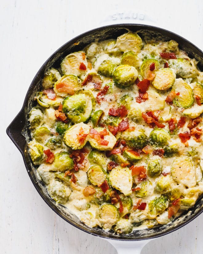 Cheesy Creamy Brussel Sprouts With Bacon in a baking dish