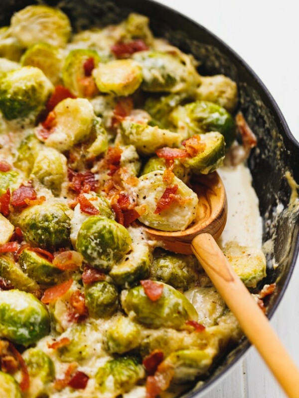 Cheesy Creamy Brussel Sprouts With Bacon in a skillet
