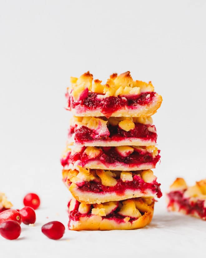 low-carb cranberry crumb bars stacked on top of each other