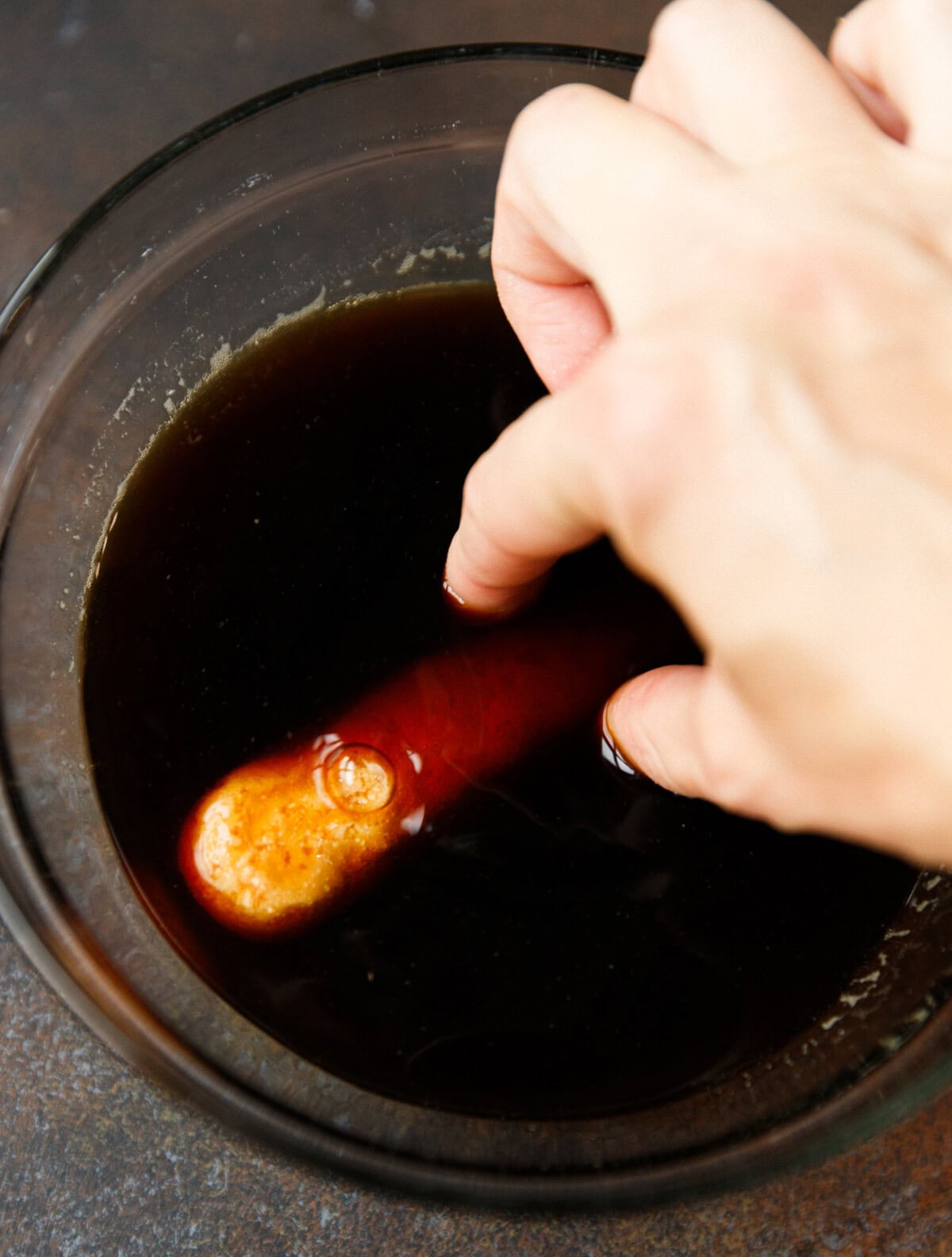 Dipping lady fingers into espresso