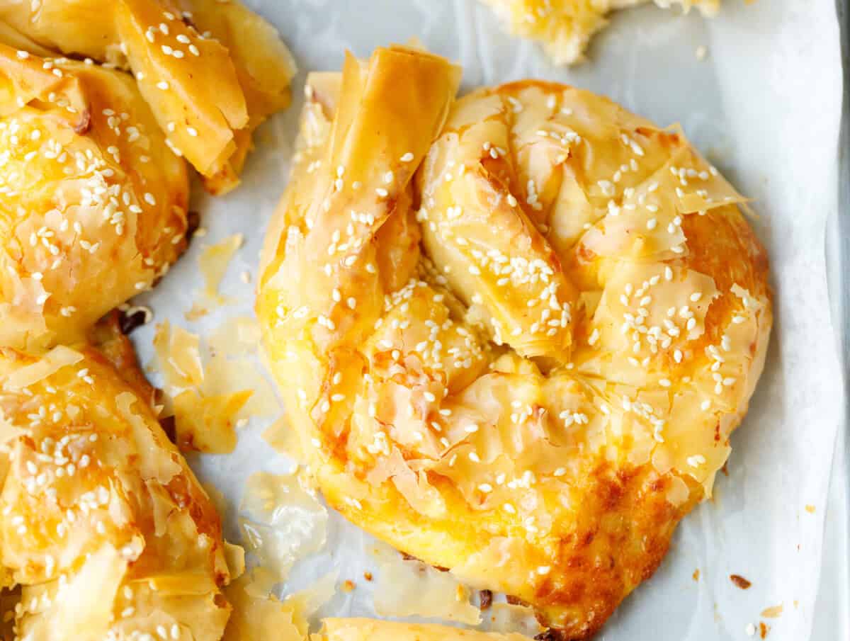 Close up of crispy golden Bulgarian banitsa made with phyllo dough and feta cheese filling