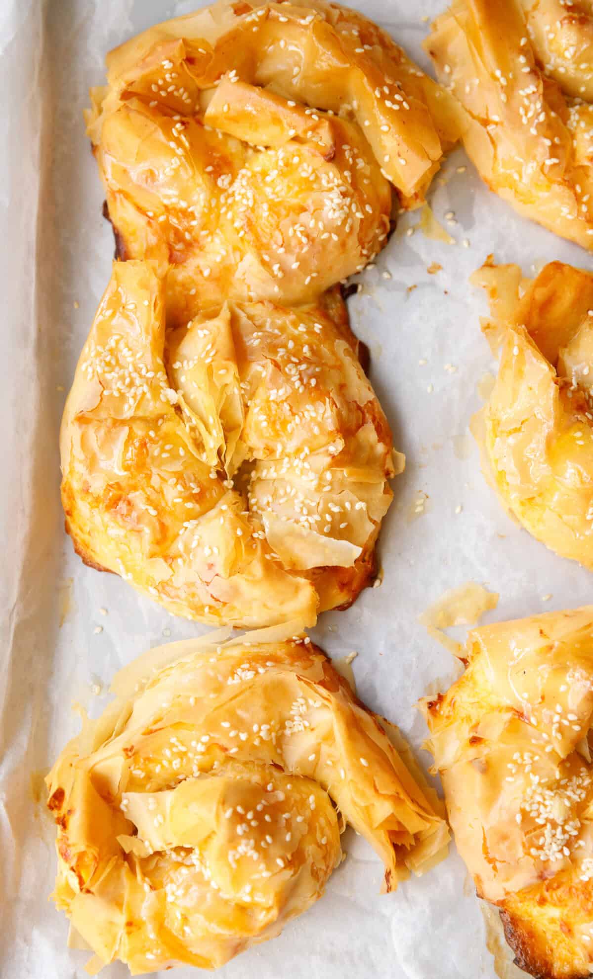 Freshly baked Bulgarian banitsa with golden crispy phyllo layers and sesame seeds
