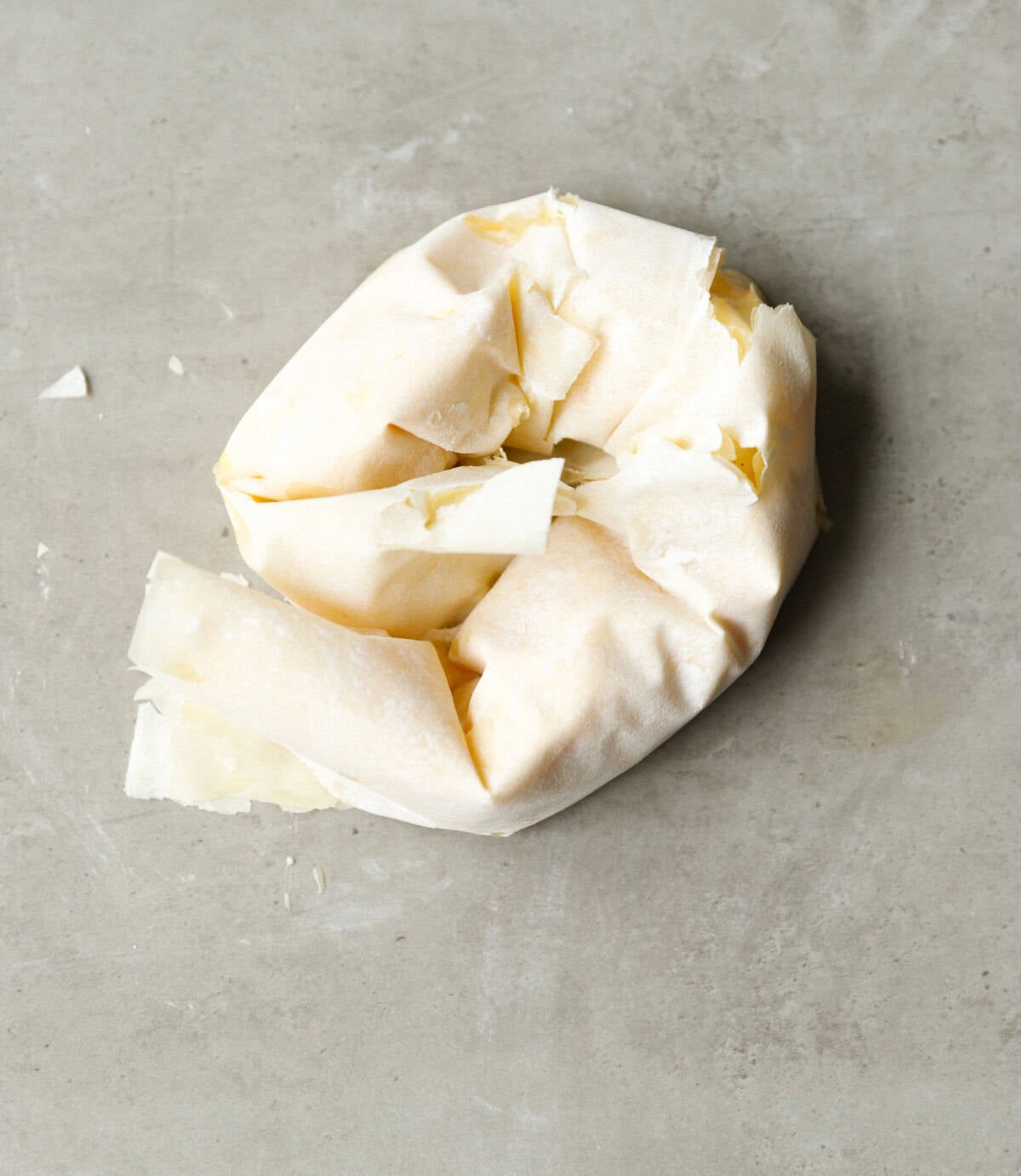 Rolled phyllo dough shaped into a spiral swirl for traditional Bulgarian banitsa