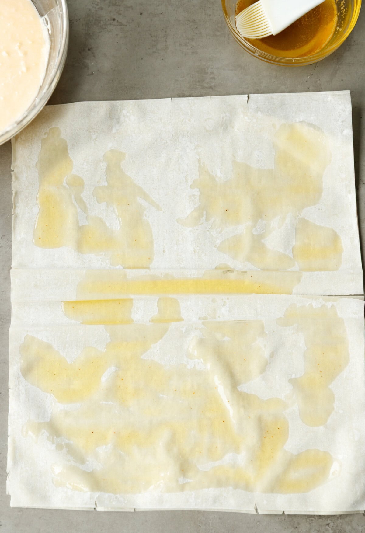 Phyllo dough sheets brushed with melted butter for making Bulgarian banitsa