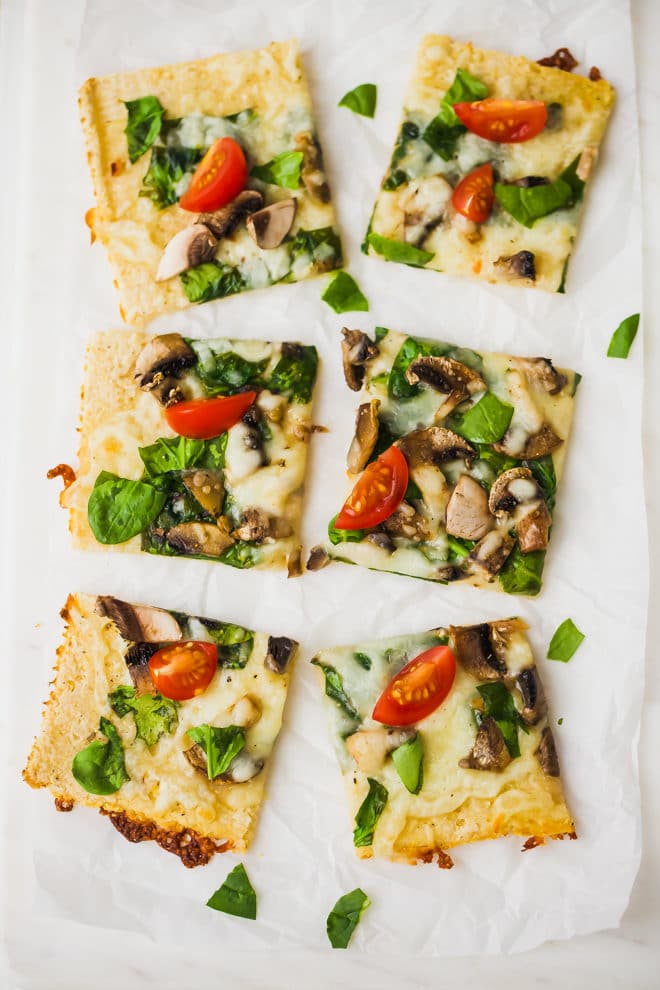 Easy Cauliflower Pizza With Spinach And Mushrooms cut into s