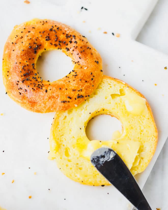 Keto bagel cut in half with butter on top