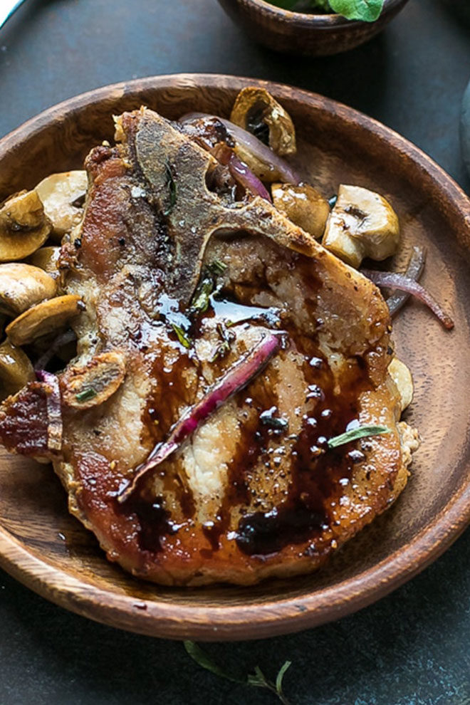 One Pan Pork Chops with balsamic on a wooden plate
