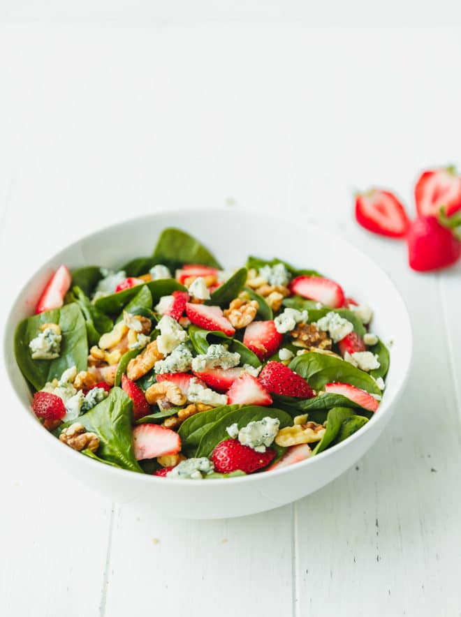 The best strawberry spinach salad in a white bowl