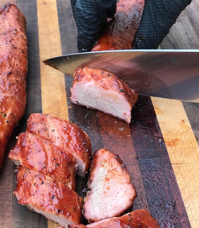 smoked pork tenderloin on a cutting board