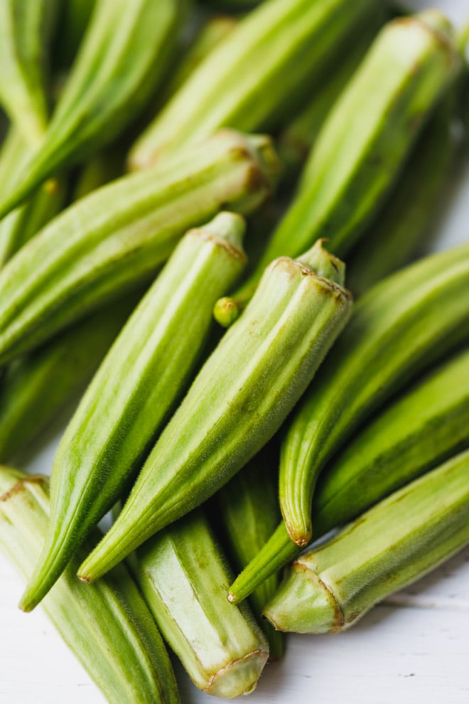 Okra pods cut into pieces to make baked okra