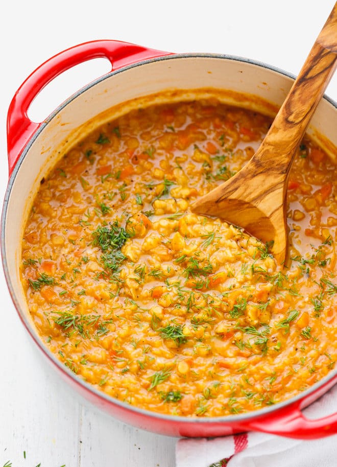 Red lentil soup in a red Dutch oven
