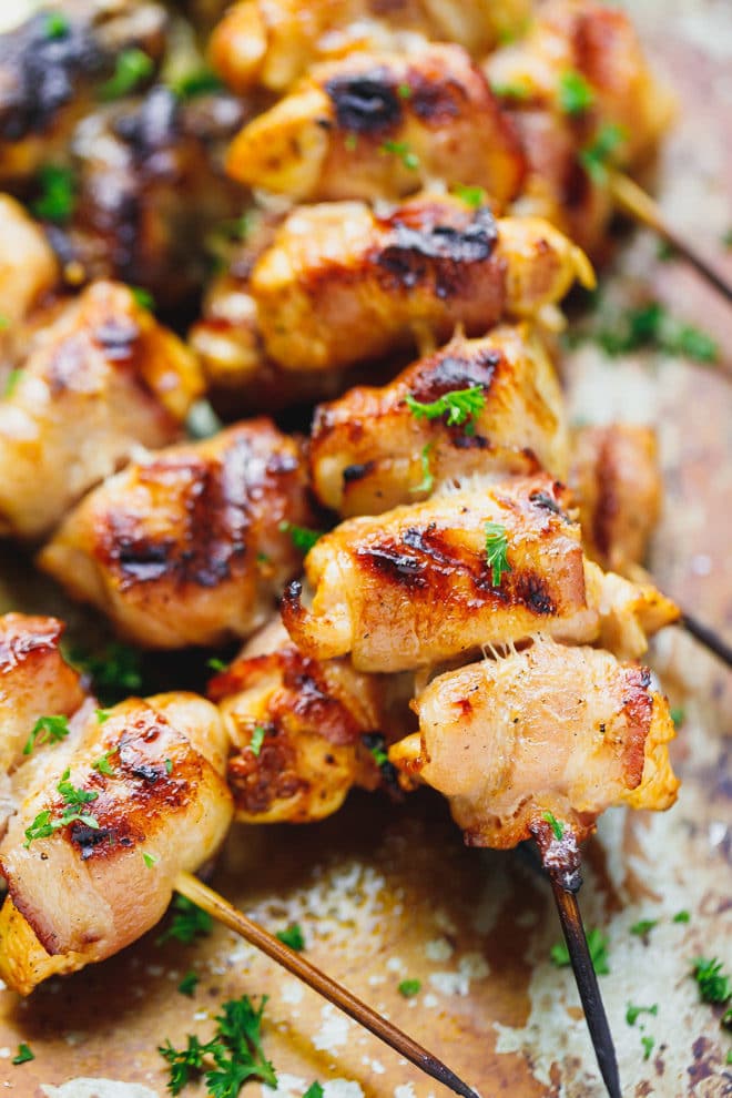 bacon wrapped chicken kebabs on a tray