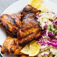 Grilled chicken thighs on a plate