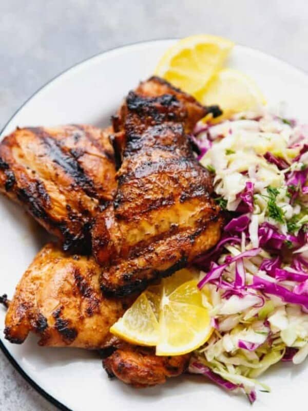 Grilled chicken thighs on a plate