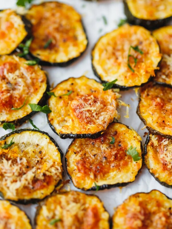 Baked Zucchini Chips on parchment paper