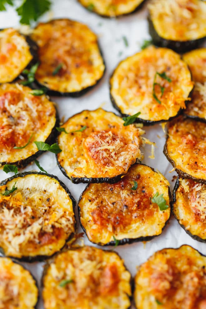 Baked Zucchini Chips on parchment paper