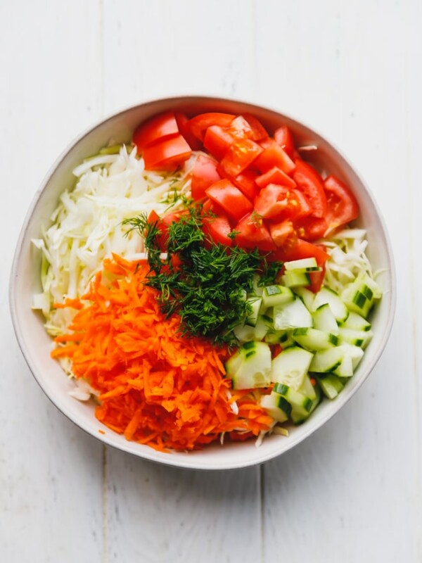 cabbage salad in a white bowl