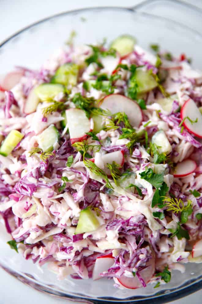 Cabbage salad with radishes in a bowl