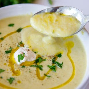 Best zucchini soup recipe in a white bowl