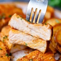 Sliced juicy pork chops on a plate.