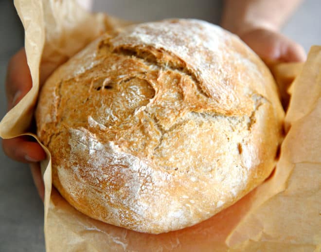 No knead bread loaf on parchment paper