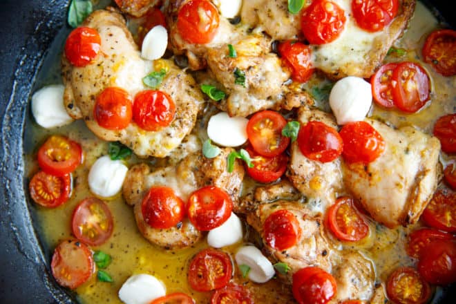 Caprese chicken thighs in a pan