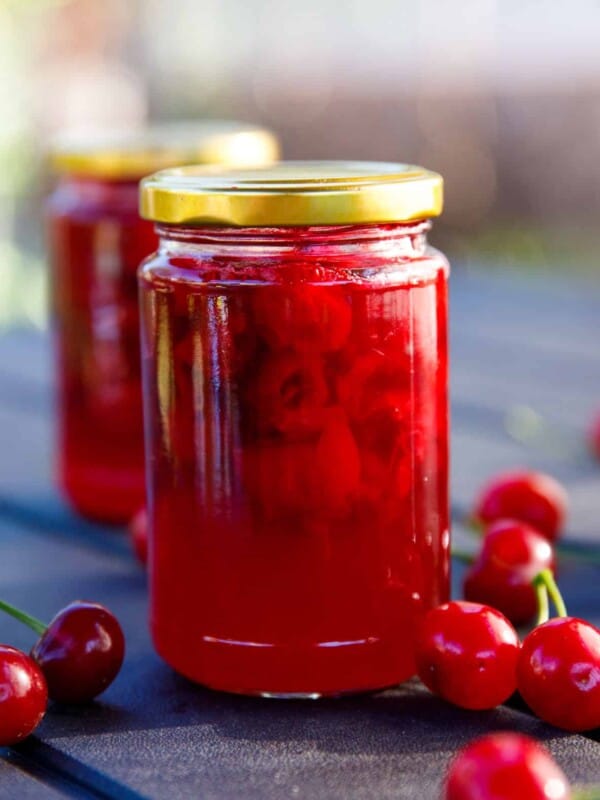 Tart cherry jam in small clear jars
