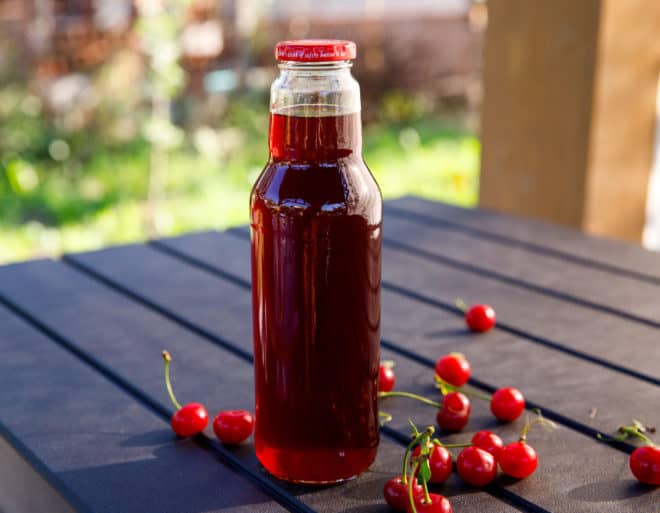 Tart cherry concentrate in a clear bottle