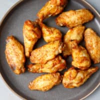 Air fryer chicken wings on a gray plate
