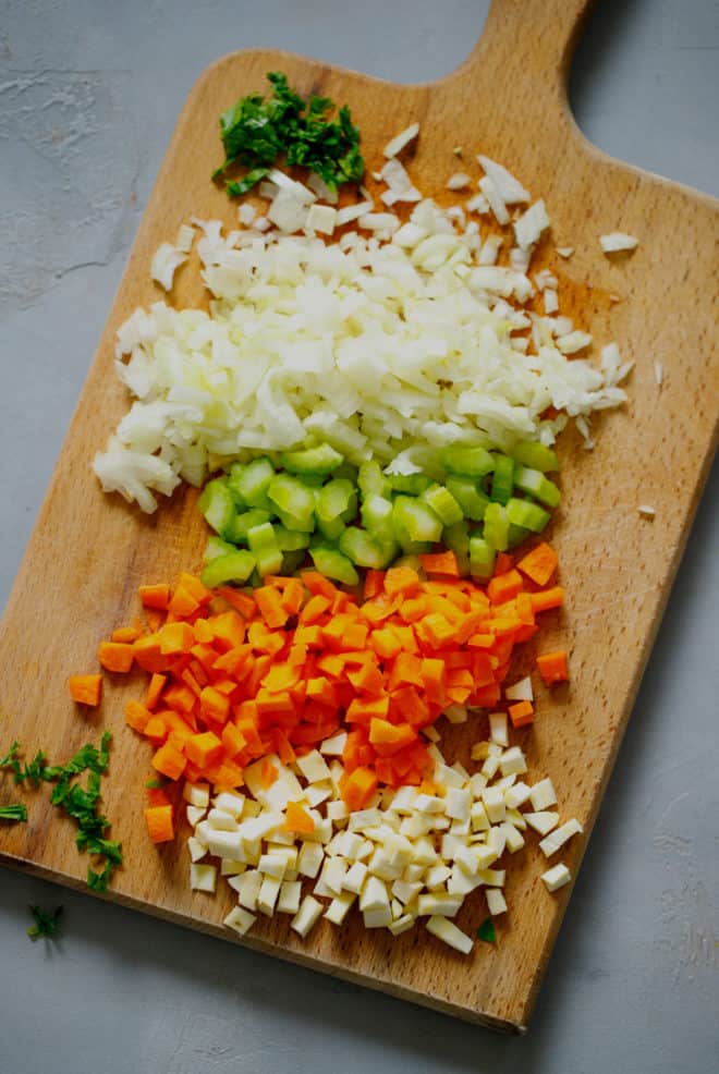 Chopped vegetables for chicken soup on a cutting board