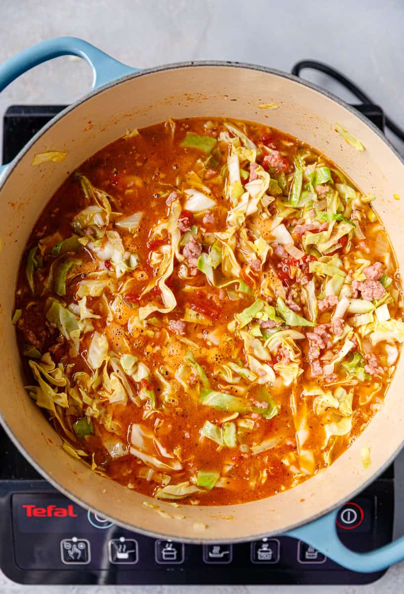 A pot with cabbage coup before being simmered and fully cooked