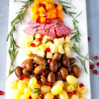 A marble board with Christmas tree cheese tray appetizer