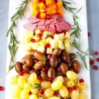 A marble board with Christmas tree cheese tray appetizer