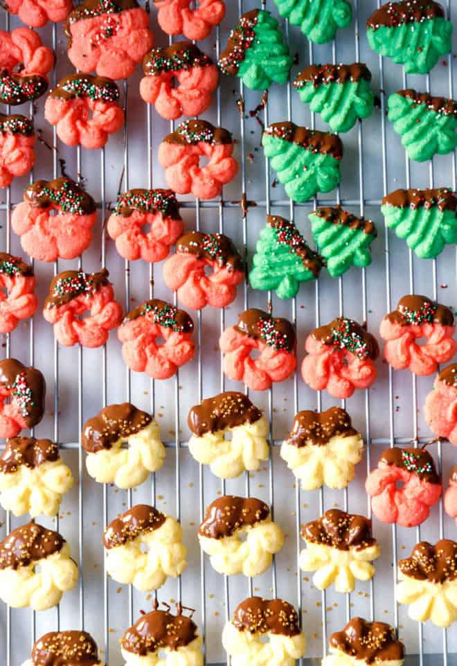 Christmas Spritz cookies in different colors on a wire rack