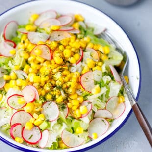 Iceberg corn and radishes in a bowl