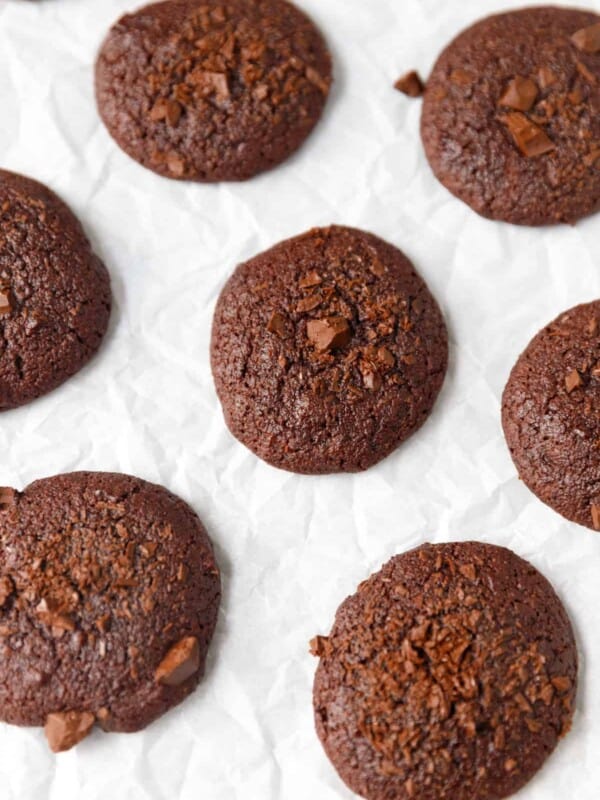 vegan chocolate almond flour cookies on parchment paper