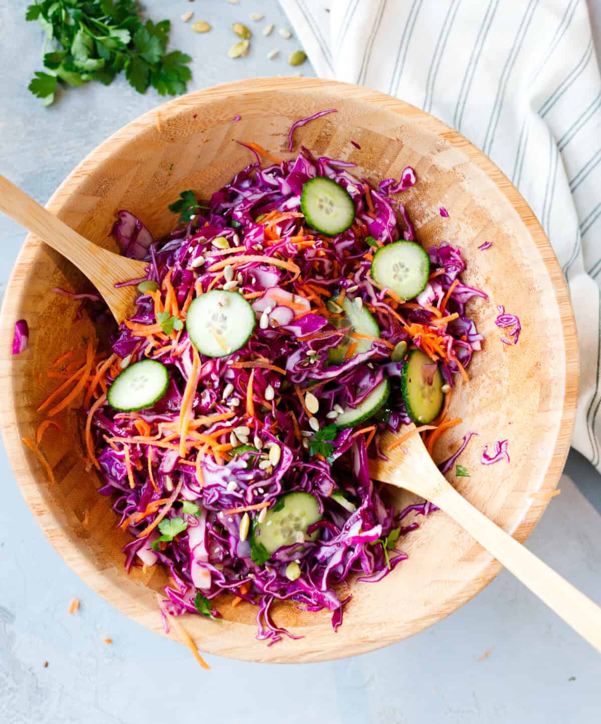 Healthy red cabbage salad with olive oil dressing and fresh vegetables