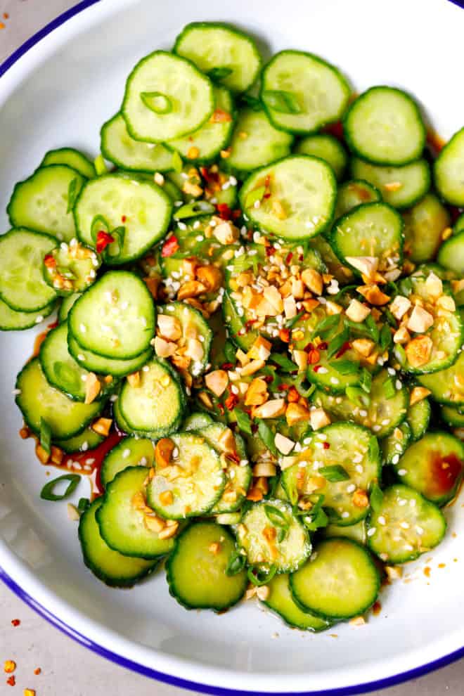 Asian cucumber salad in a white bowl