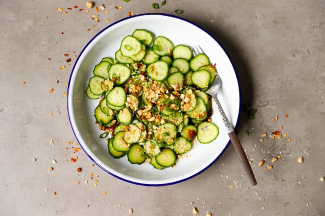 A white bowl with Asian cucumber salad