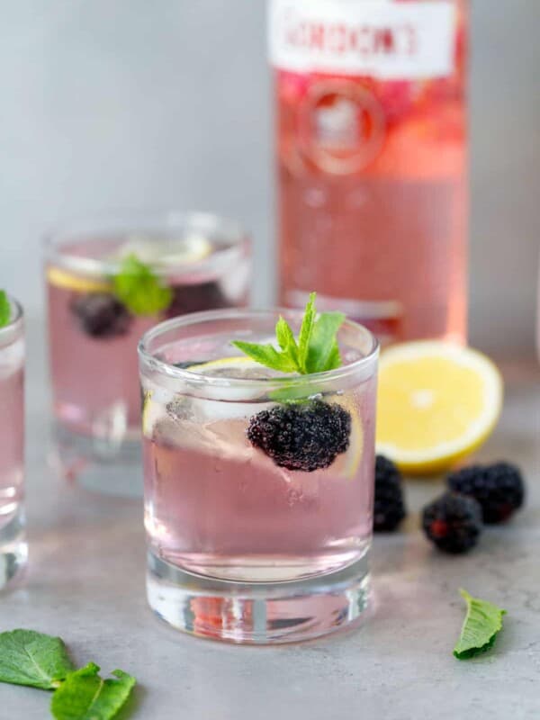 Two glasses with pink gin and tonic