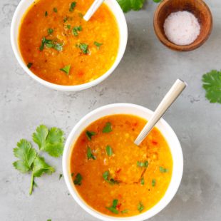 Two small ceramic bowls with Instant pot red lentil soup
