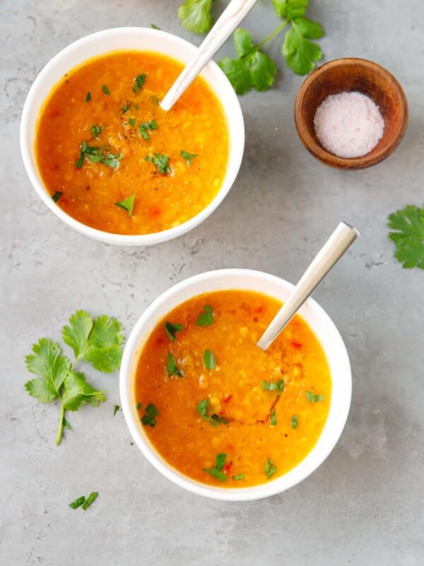 Two small ceramic bowls with Instant pot red lentil soup